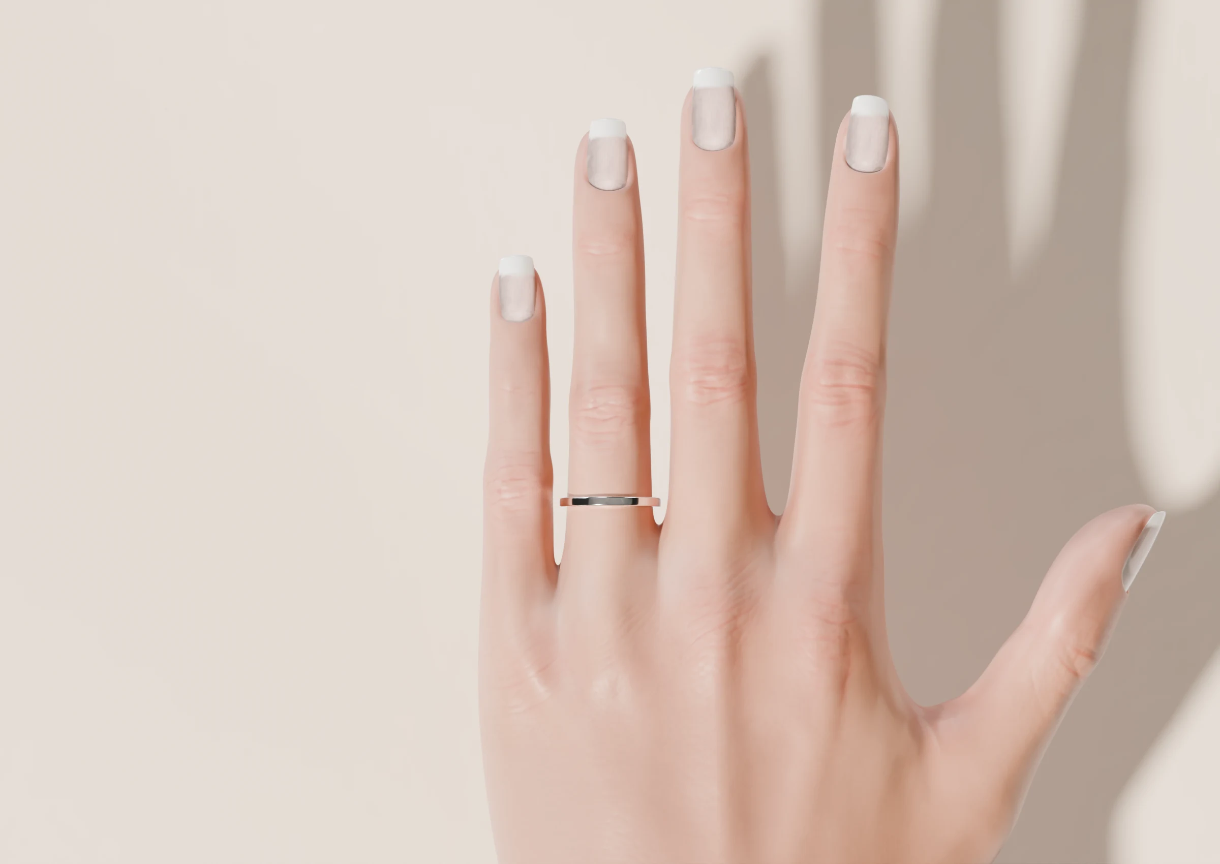 A hand seen from above, wearing a plain band
