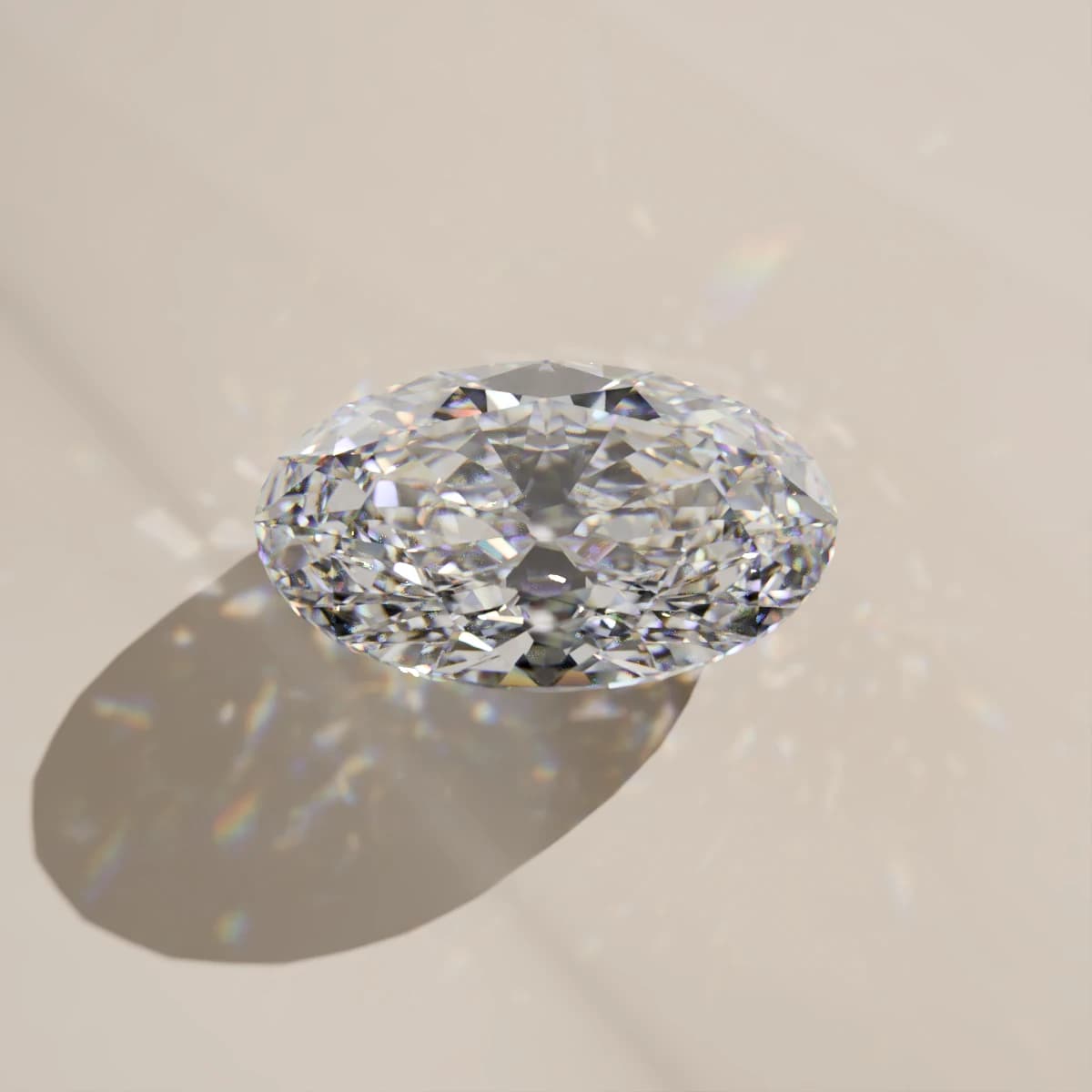 An oval moissanite seen from above on a pale surface